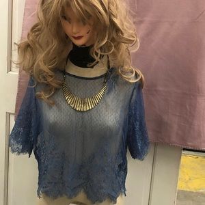 Blue woman’s see through blouse size small.